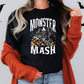 a woman wearing a black monster mash t - shirt