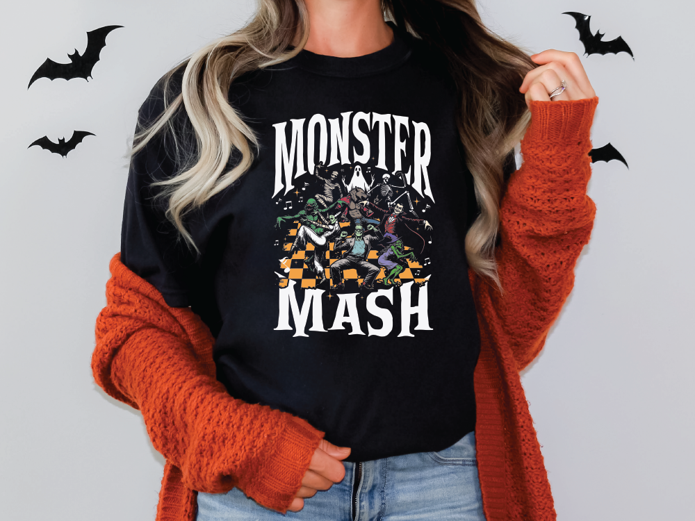 a woman wearing a black monster mash t - shirt