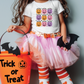 a little girl in a trick or treat costume holding a trick or treat bucket