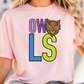A woman wearing a pink t-shirt with the letters "OWL" and a cartoon owl graphic printed on it.
