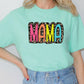 a woman wearing a green shirt with the word mama printed on it