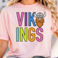 A person wearing a pink t-shirt with the text "VIKINGS" and a cartoon Viking helmet printed on it.