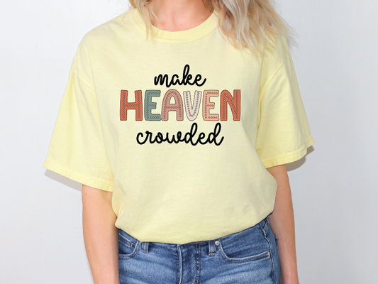 a woman wearing a yellow t - shirt that says make heaven crowded