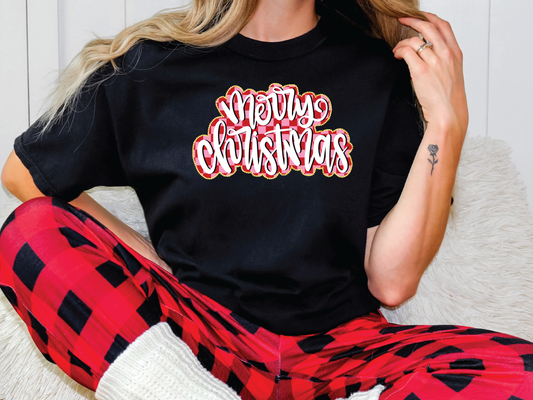 a woman wearing a black merry christmas t - shirt