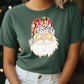 a woman wearing a green t - shirt with a santa clause on it