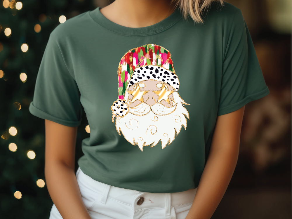 a woman wearing a green t - shirt with a santa clause on it