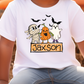 a young boy wearing a personalized halloween t - shirt