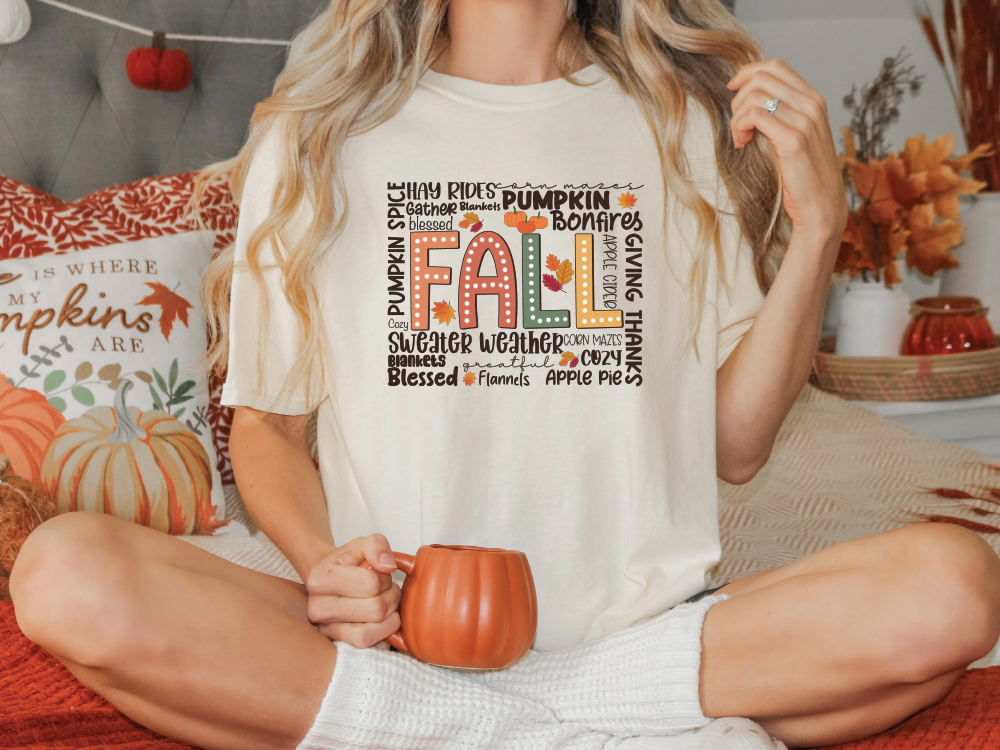 a woman sitting on a bed holding a pumpkin