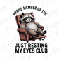 a raccoon sitting in a chair with the words proud member of the just
