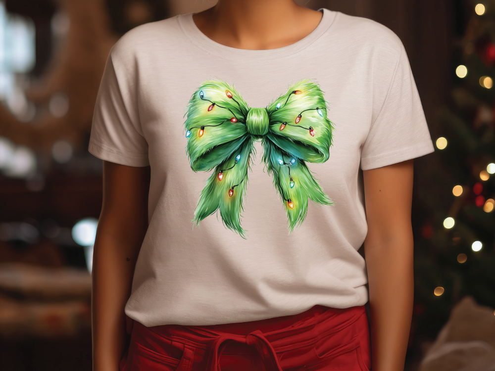 a woman wearing a white shirt with a green bow on it