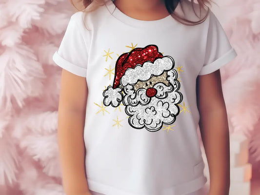 a little girl wearing a santa claus shirt