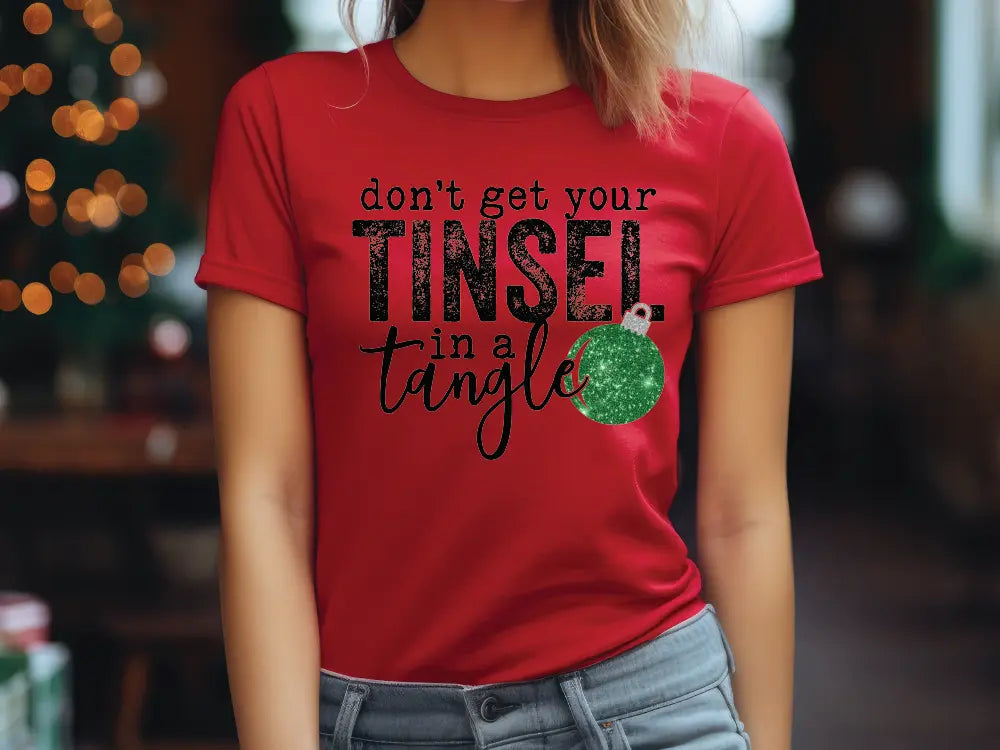 a woman wearing a red t - shirt that says don't get your tin