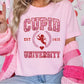 a woman wearing a pink cupid university t - shirt