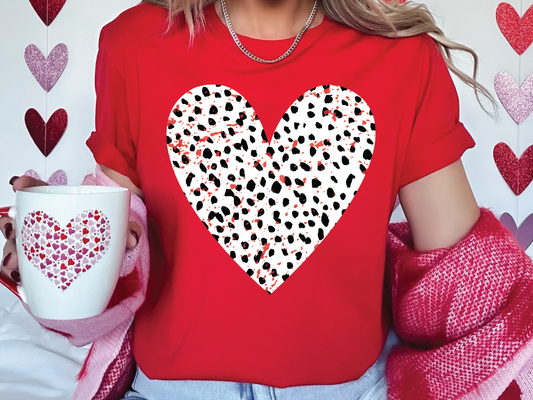 a woman wearing a red shirt with a heart on it