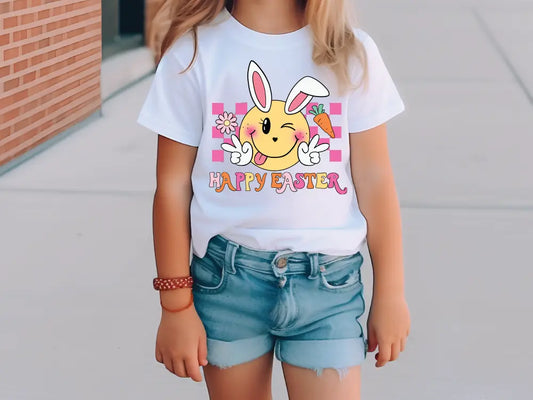 a little girl wearing a happy easter t - shirt