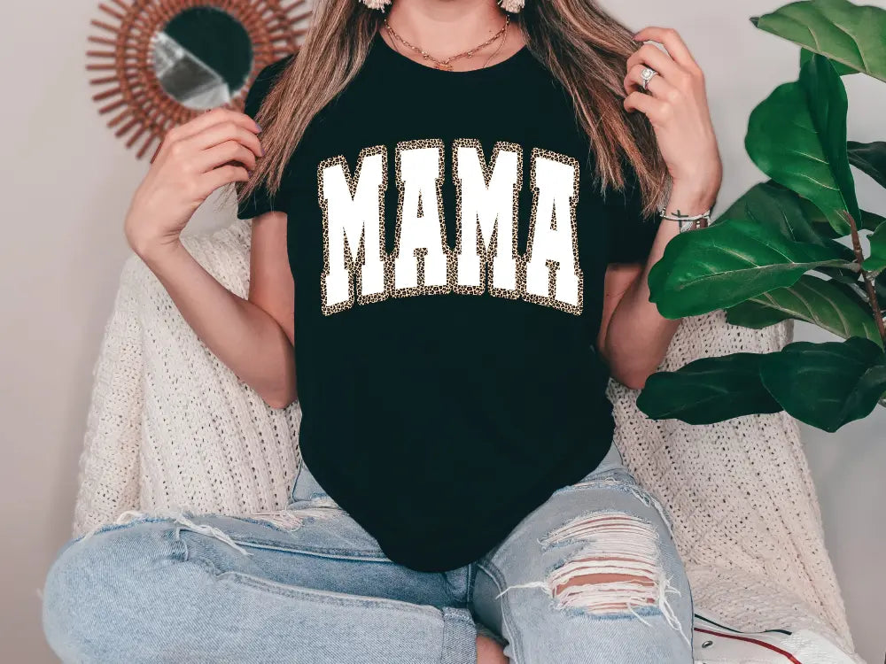 a woman sitting on a couch holding a mirror