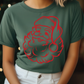 a woman wearing a green shirt with a red santa clause on it