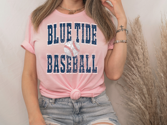 a woman wearing a blue tide baseball shirt