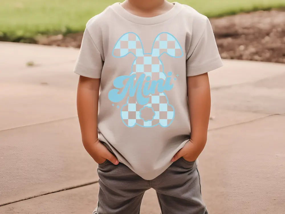 a young boy wearing a mickey mouse shirt