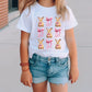 a little girl wearing a t - shirt with a dog on it
