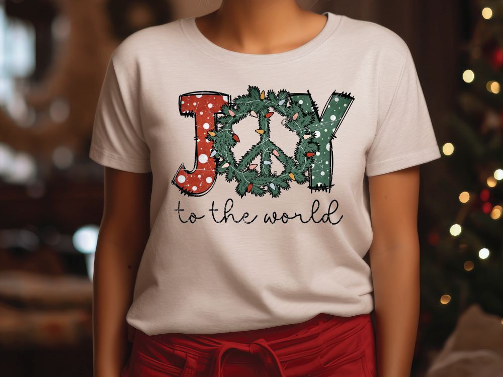 a woman wearing a t - shirt that says joy to the world