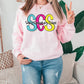 a woman wearing a pink sweatshirt with the word sos on it