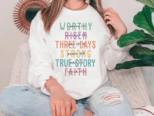 a woman sitting on a couch wearing a white sweatshirt