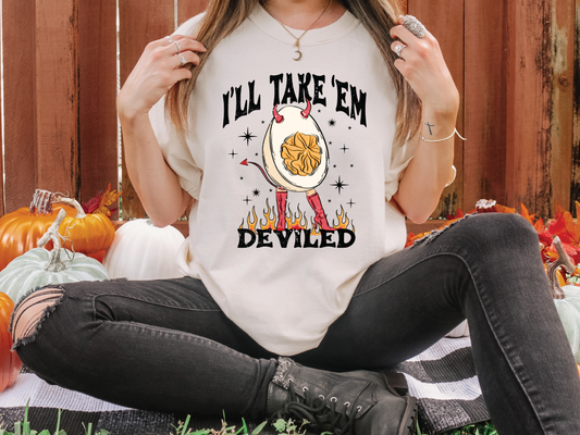 a woman wearing a t - shirt that says i'll take em deviled