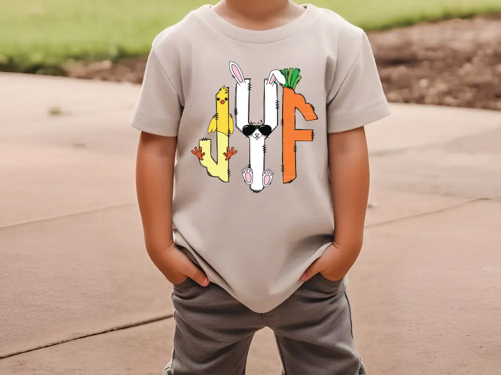 a young boy wearing a t - shirt with a picture of a dog on it