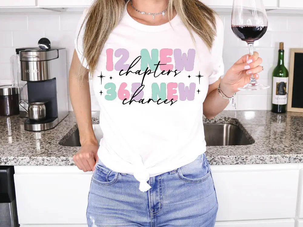 a woman holding a glass of wine in a kitchen