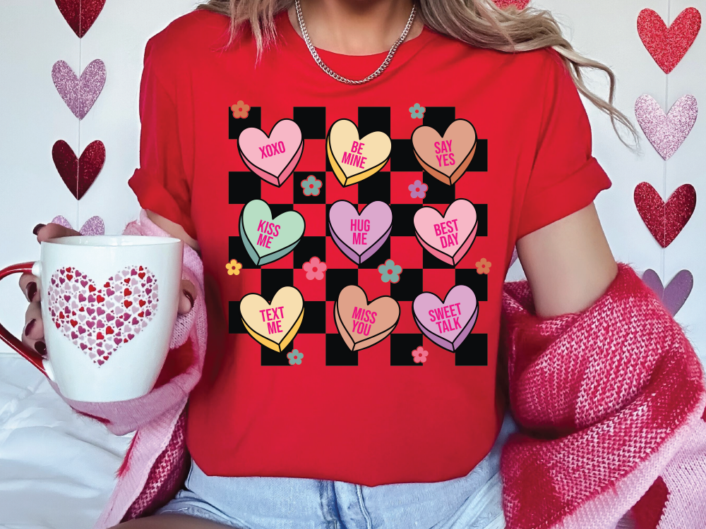 a woman wearing a red shirt with hearts on it