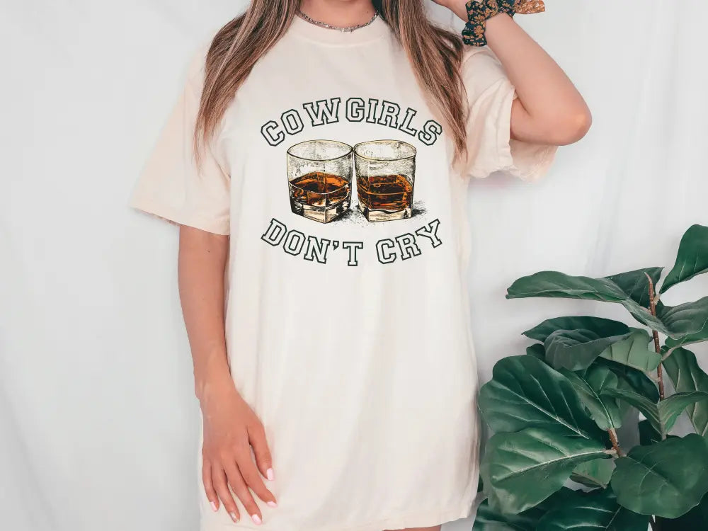 a woman wearing a cowgirl's don't cry t - shirt dress