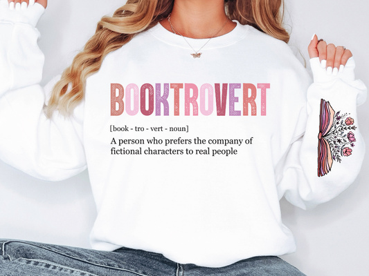 a woman wearing a white sweatshirt with a booktrover written on it