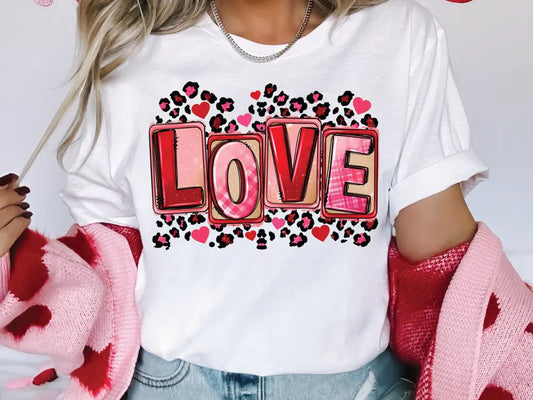 a woman wearing a t - shirt with the word love printed on it