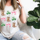 a woman sitting on a couch wearing a t - shirt with boots and shamrocks