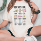 a woman sitting on the ground wearing a t - shirt that says good says i
