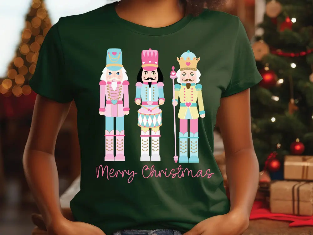 a woman wearing a green t - shirt with three nutcrackers on it