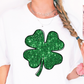 a woman wearing a t - shirt with a shamrock on it