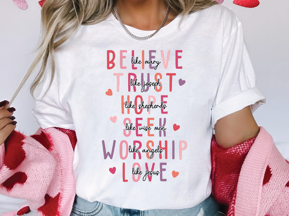 a woman wearing a t - shirt that says believe, trust, hope, hope