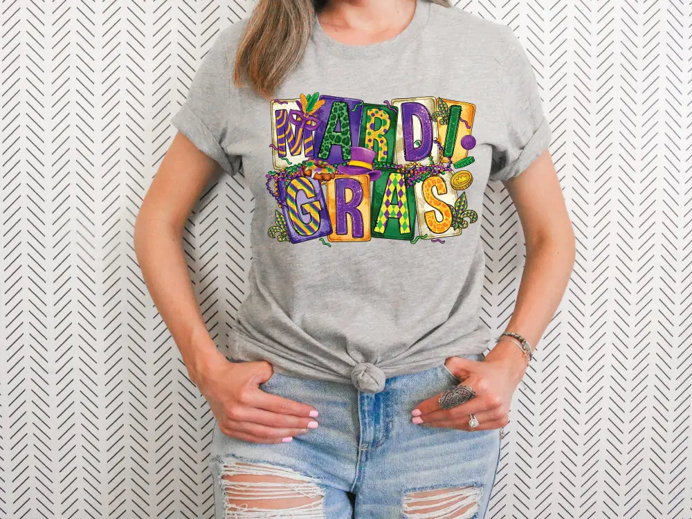 a woman wearing a mardi gras t - shirt