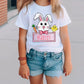 a little girl wearing a happy easter bunny t - shirt