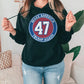a woman wearing a black hoodie with the number 47 on it