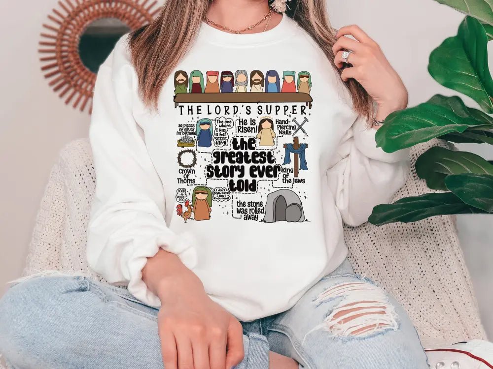 a woman wearing a white sweatshirt with the words the lord's supper on it