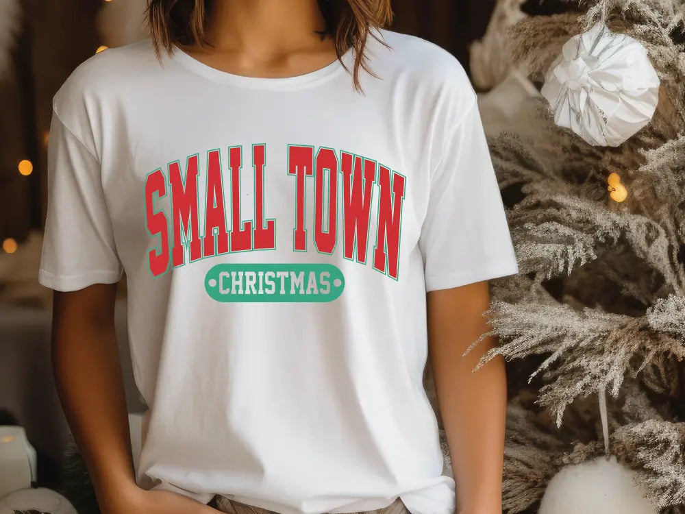 a woman standing in front of a christmas tree