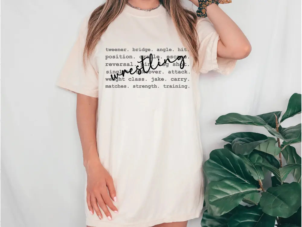 a woman wearing a t - shirt dress with words printed on it