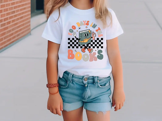 a little girl wearing a white shirt and blue shorts