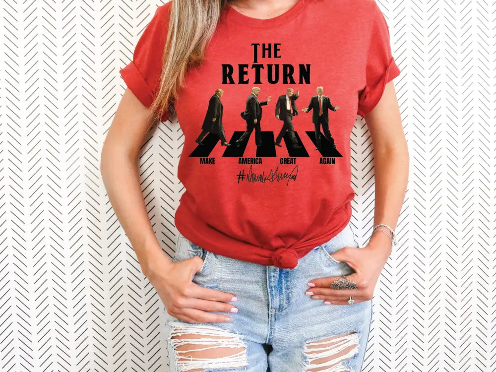 a woman wearing a red shirt with the beatles on it