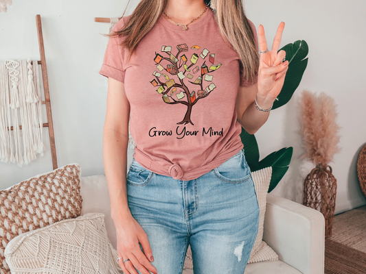 a woman wearing a t - shirt that says grow your mind