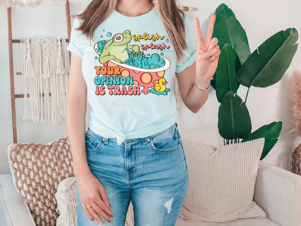 a woman standing in front of a couch holding a peace sign