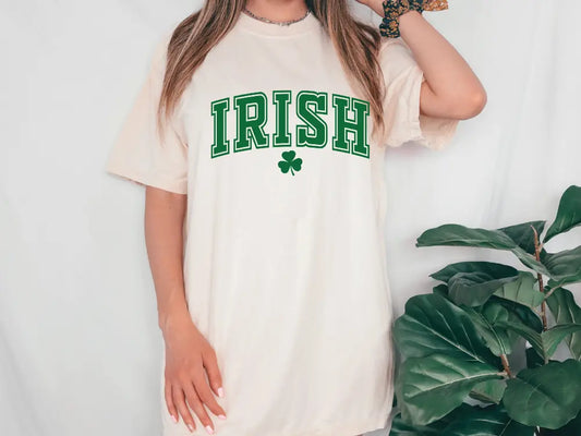 a woman wearing a irish t - shirt with a shamrock on it